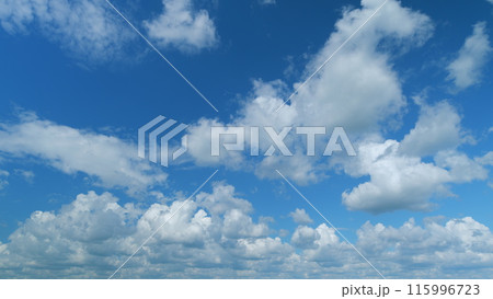 Blue sky white puffy fluffy clouds billow in high space. Sky with clouds weather. Time lapse. 115996723