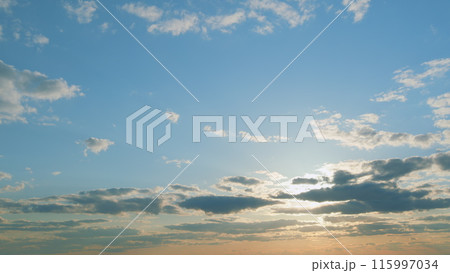 Evening sky at sunset in different shades. Beautiful romantic and colorful sky with brightly gradient color. Timelapse. 115997034