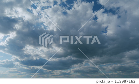 Sky with bautiful silky clouds. Puffy fluffy stratocumulus and stratus clouds. Timelapse. 115997162