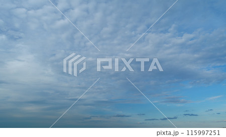 Fluffy layered clouds sky atmosphere. Puffy fluffy white clouds. Formation cloud sky scape. Timelapse. Fluffy layered clouds sky atmosphere. Puffy fluffy white clouds. Formation cloud sky scape. Timelapse. 115997251