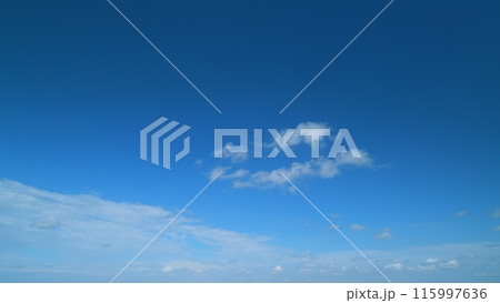 Tropical summer sunlight. Blue sky with cumulus and stratocumulus clouds. Fluffy layered clouds sky atmosphere. Timelapse. Tropical summer sunlight. Blue sky with cumulus and stratocumulus clouds. Fluffy layered clouds sky atmosphere. Timelapse. 115997636
