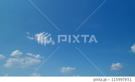 Blue sky with copyspace background with forming clouds in summer day outdoors. Timelapse. Blue sky with copyspace background with forming clouds in summer day outdoors. Timelapse. 115997651