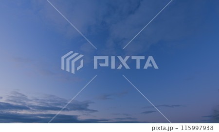 Evening sky at sunset in different shades. Beautiful romantic and colorful sky with brightly gradient color. Timelapse. 115997938