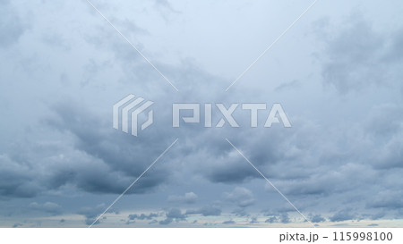 Dark storm clouds dramatic shadowy sky background. Dark grey storm clouds. Timelapse. Dark storm clouds dramatic shadowy sky background. Dark grey storm clouds. Timelapse. 115998100