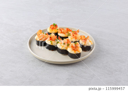 Set of baked sushi roll with shrimp and salmon on a black background. Japanese food, photo for menu Set of baked sushi roll with shrimp and salmon on a black background. Japanese food, photo for menu 115999457