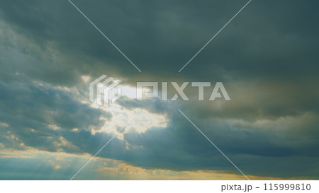 Sunbeam With Haze On Blue Sky. Beams With Clouds. Sky With Sun Coming With Clouds. 115999810