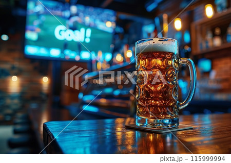 Cold Beer Mug in Sports Bar with Goal on TV Screen - celebrating victory in football 115999994