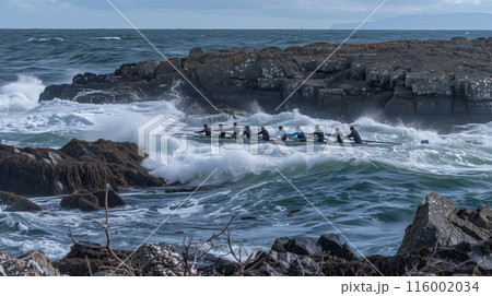Rowers fiercely battle choppy waves, synchronizing their strokes against nature's relentless force. Rowers fiercely battle choppy waves, synchronizing their strokes against nature's relentless force. 116002034