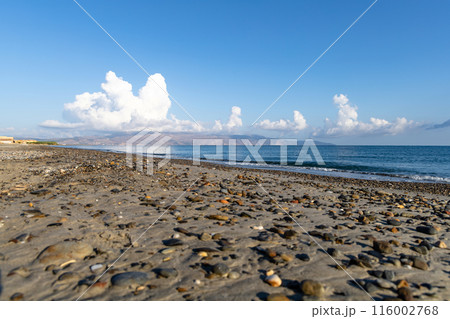 Sea shore. Beautiful empty beach in summer sunny day on Crete island in Greece. Sea shore. Beautiful empty beach in summer sunny day on Crete island in Greece. 116002768