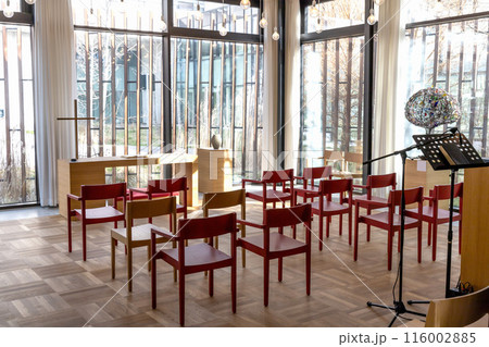 Church room for prayer and privacy with a large cross and chairs for visitors. Church room for prayer and privacy with a large cross and chairs for visitors. 116002885