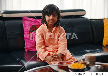 Indian Child Drinking Tea At Home 116004719