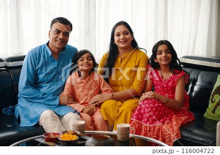 Happy Indian Family Sitting At Home 116004722