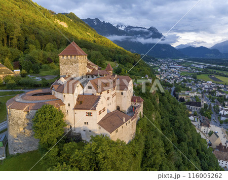 Vaduz Castle in Liechtenstein. Picturesque view of fairytale castle in Alps mountains at Sunset Time. A Landmark Aerial Vaduz Castle in Liechtenstein. Picturesque view of fairytale castle in Alps mountains at Sunset Time. A Landmark Aerial 116005262