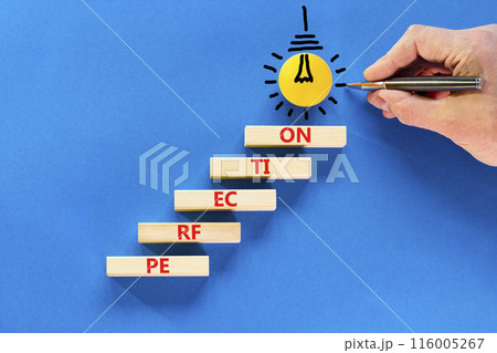Perfection symbol. Concept word Perfection on beautiful wooden blocks. Light bulb icon. Businessman hand with pencil. Beautiful blue background. Business perfection concept. Copy space. Perfection symbol. Concept word Perfection on beautiful wooden blocks. Light bulb icon. Businessman hand with pencil. Beautiful blue background. Business perfection concept. Copy space. 116005267