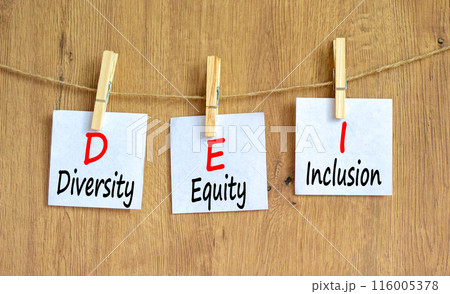 DEI diversity equity and inclusion symbol. Concept words DEI diversity equity inclusion on beautiful paper. Beautiful wooden background. Business DEI diversity equity and inclusion concept. Copy space 116005378