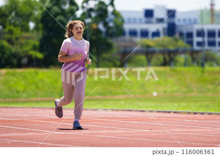 Elderly woman exercising. Fit senior lady running. 116006361
