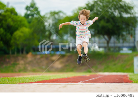 Kids long jump athletics training. Child jumping. Kids long jump athletics training. Child jumping. 116006485