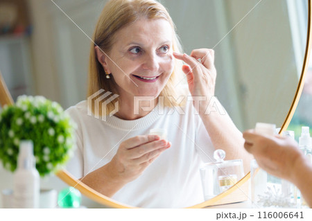 Skin care for senior woman. Anti-aging cream. Skin care for senior woman. Anti-aging cream. 116006641