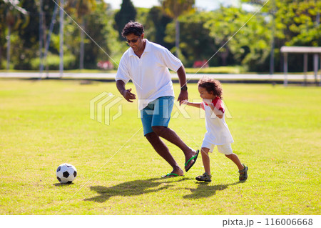 Father and son play football. Young active family. Father and son play football. Young active family. 116006668