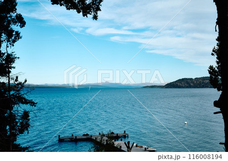 Beautiful mountain lake. Transparent blue water. Shore pier. Beautiful mountain lake. Transparent blue water. Shore pier. 116008194