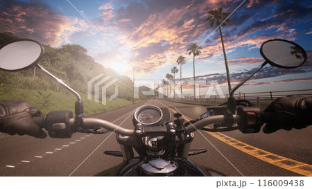 POV riding a motorcycle at sunset POV riding a motorcycle at sunset 116009438