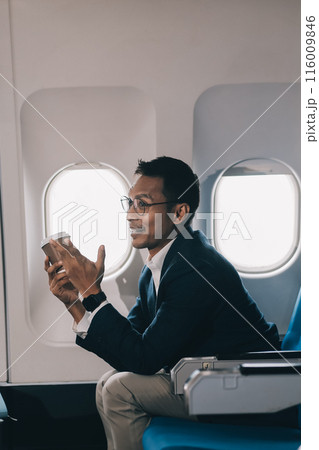 Businessman flying on his private jet. Concept about business, and transportation Businessman flying on his private jet. Concept about business, and transportation 116009846