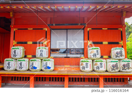 Fujinomiya, Japan April 8, 2024: Sake fermentation tank in Fujisan Hongu Sengen Taisha Shinto Shrine where cherry blossoms are blooming on a rainy day at Shizuoka, Japan. 116016164