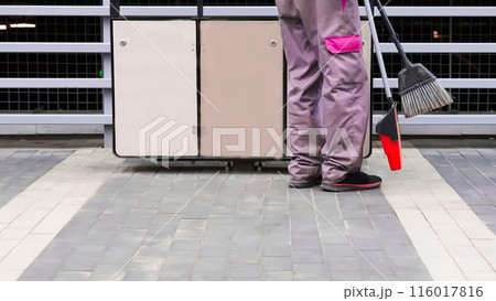 Waste containers and janitors feet, keep your planet Earth clean Waste containers and janitors feet, keep your planet Earth clean 116017816