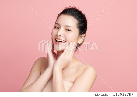 Beautiful young asian woman with clean fresh skin on pink background, Face care, Facial treatment, Cosmetology, beauty and spa, Asian women portrait. Beautiful young asian woman with clean fresh skin on pink background, Face care, Facial treatment, Cosmetology, beauty and spa, Asian women portrait. 116018797