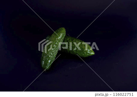 fresh green cucumber on a black background 116022751