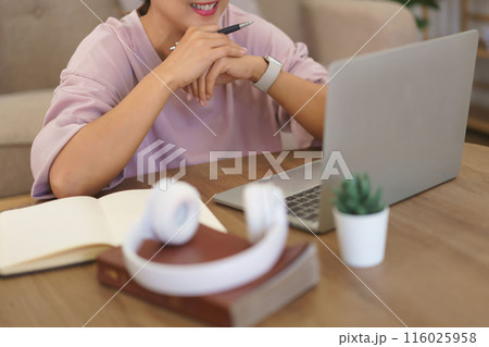 Female entrepreneur working to reading data on laptop and thoughtful about new startup project Female entrepreneur working to reading data on laptop and thoughtful about new startup project 116025958
