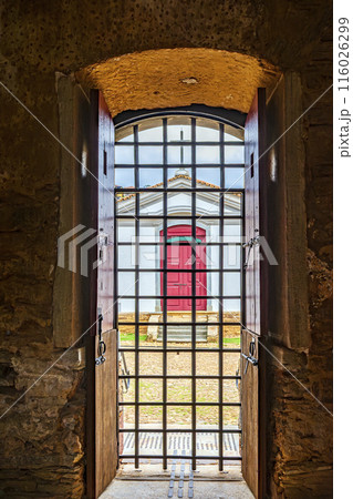Small church seen from inside an old prison Small church seen from inside an old prison 116026299