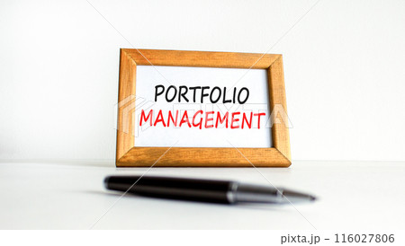 Portfolio management symbol. Concept words Portfolio management on beautiful wooden picture frame. Beautiful white paper background. Black pen. Business Portfolio management concept. Copy space. 116027806
