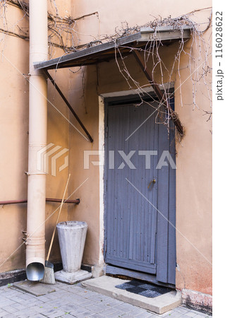 Old wooden door of a house 116028622