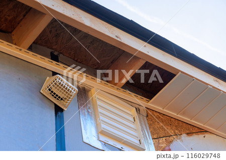 Installed along roofline of house, vinyl white uPVC soffit board below facia roof. Installed along roofline of house, vinyl white uPVC soffit board below facia roof. 116029748