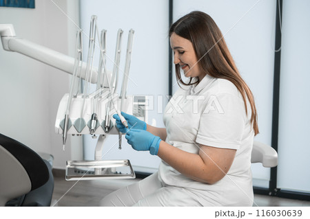 With a smile on her face, the doctor strives to relax and relieve fear in her patients, creating an atmosphere of trust. Her smile is not only a professional endurance, but also a medicine that makes With a smile on her face, the doctor strives to relax and relieve fear in her patients, creating an atmosphere of trust. Her smile is not only a professional endurance, but also a medicine that makes 116030639