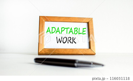 Adaptable work symbol. Concept words Adaptable work on beautiful wooden picture frame. Beautiful white paper background. Black pen. Business Adaptable work concept. Copy space. Adaptable work symbol. Concept words Adaptable work on beautiful wooden picture frame. Beautiful white paper background. Black pen. Business Adaptable work concept. Copy space. 116031118