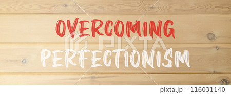 Overcoming perfectionism symbol. Concept words Overcoming perfectionism on beautiful wooden wall. Beautiful wooden wall background. Business Overcoming perfectionism concept. Copy space. 116031140