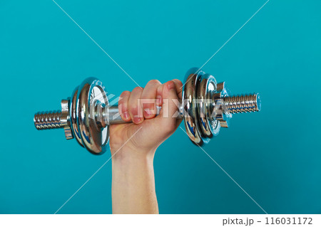 Male hand holding heavy dumbbells 116031172