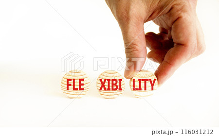 Flexibility symbol. Concept word Flexibility on beautiful wooden circles. Beautiful white table white background. Businessman hand. Business flexibility concept. Copy space. Flexibility symbol. Concept word Flexibility on beautiful wooden circles. Beautiful white table white background. Businessman hand. Business flexibility concept. Copy space. 116031212