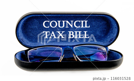 Business and finance concept. COUNCIL TAX BILL text written symbol on the inside of the glasses case on a white background Business and finance concept. COUNCIL TAX BILL text written symbol on the inside of the glasses case on a white background 116031528
