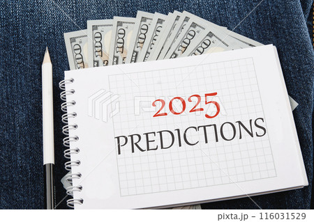 Business concept. Copy space.2025 predictions symbol on a checkered notebook in a composition with dollars bills and a pencil 116031529