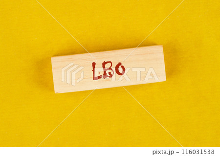Business concept. Words Leveraged Buyout LBO written on wooden blocks on a bright yellow mustard background Business concept. Words Leveraged Buyout LBO written on wooden blocks on a bright yellow mustard background 116031538