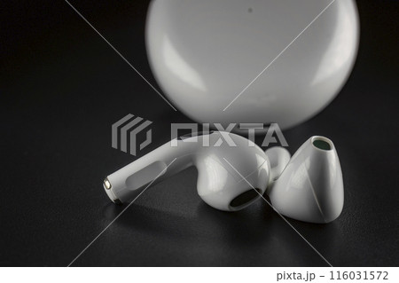 ROSTOV-ON-DON, RUSSIA - APRIL 28, 2018: Apple AirPods wireless Bluetooth headphones and charging case for Apple iPhone. New Apple Earpods Airpods in box. 116031572