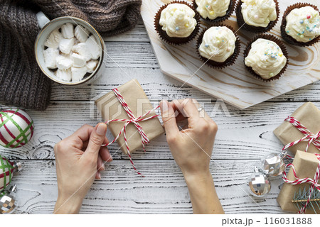 close up hands packing gift close up hands packing gift 116031888