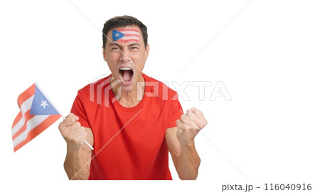 Man cheering for Puerto Rico screaming and waving a national flag Man cheering for Puerto Rico screaming and waving a national flag 116040916