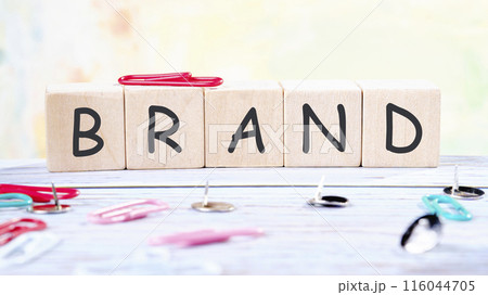 Customer retention concept. BRAND it is made of wooden cubes on a colored background Customer retention concept. BRAND it is made of wooden cubes on a colored background 116044705