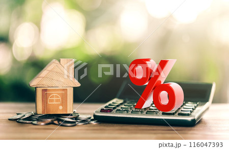 House is placed on the coin and calculator with illustration of interest concept of calculating interest payments. planning savings money of coins to buy a home. House is placed on the coin and calculator with illustration of interest concept of calculating interest payments. planning savings money of coins to buy a home. 116047393