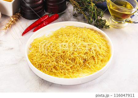 Raw dry Italian pasta Vermicelli Raw dry Italian pasta Vermicelli 116047911