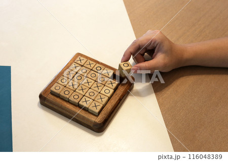 Wooden block OX game, OX tic tac toe game. 116048389